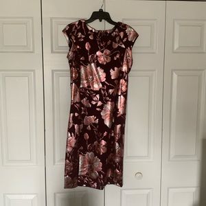 Burgundy dress with flower design.